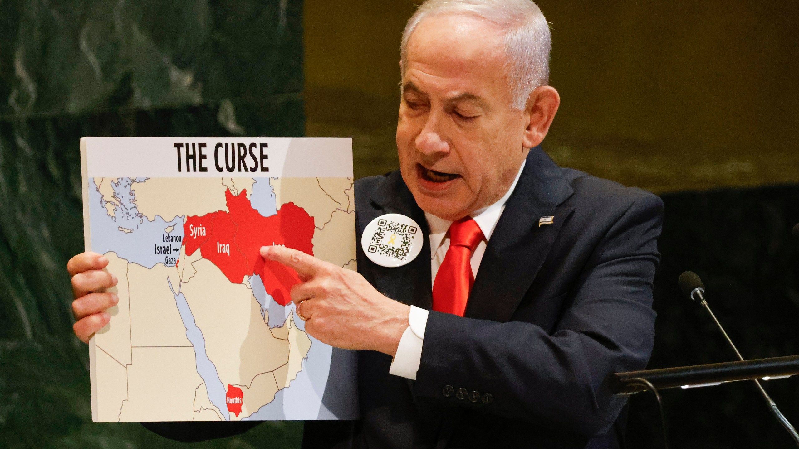 Israeli Prime Minister Benjamin Netanyahu holds up a map while speaking at the 80th session of the United Nations General Assembly, Friday, Sept. 26, 2025, at U.N. headquarters. (AP Photo/Stefan Jeremiah)