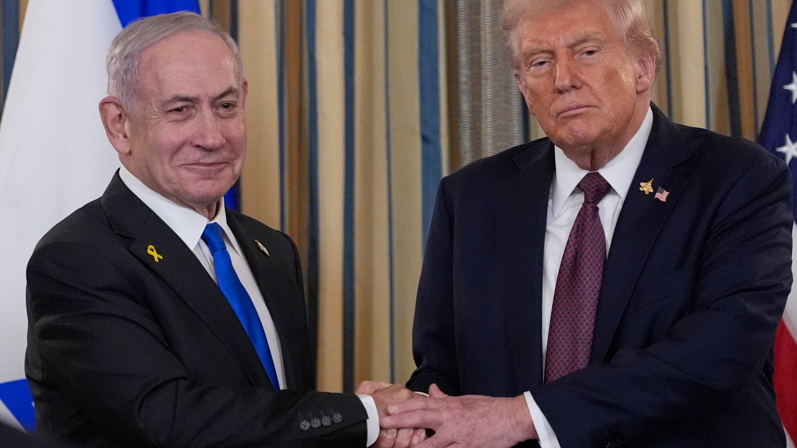 Israel's Prime Minister Benjamin Netanyahu shakes hands with President Donald Trump after a news conference in the State Dining Room of the White House, Monday, Sept. 29, 2025, in Washington. (AP Photo/Alex Brandon)