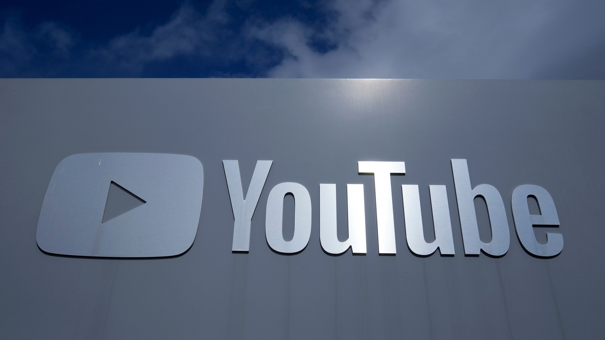 FILE - A YouTube sign is shown near the company's headquarters in San Bruno, Calif., Wednesday, March 12, 2025. (AP Photo/Jeff Chiu, file)