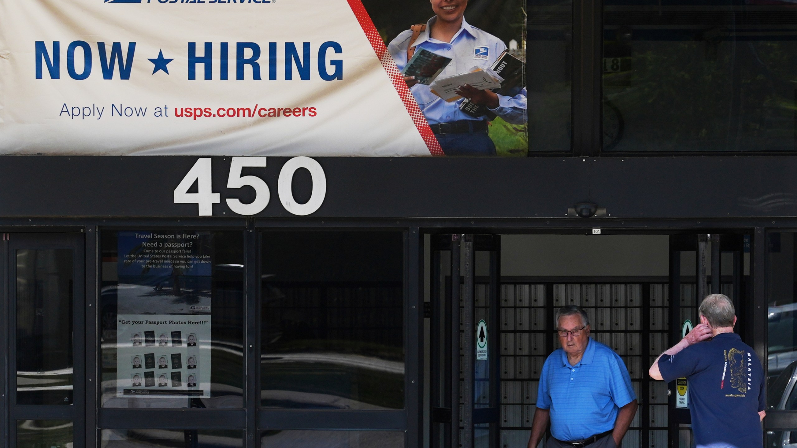 A hiring sign is displayed at a post office in Schaumburg, Ill., Thursday, Sept. 18, 2025. (AP Photo/Nam Y. Huh)