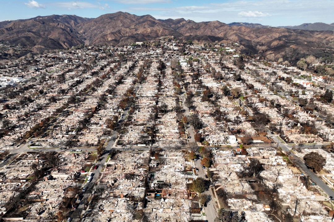An aerial view of homes reduced to rubble in the wake of the Palisades Fire