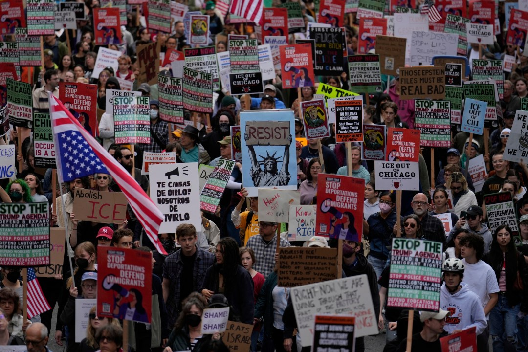 People march during Illinois Coalition for Immigrant & Refugee Rights' "Chicago Says No Trump No Troops" protest Saturday, Sept. 6, 2025, in Chicago. (AP Photo/Carolyn Kaster)