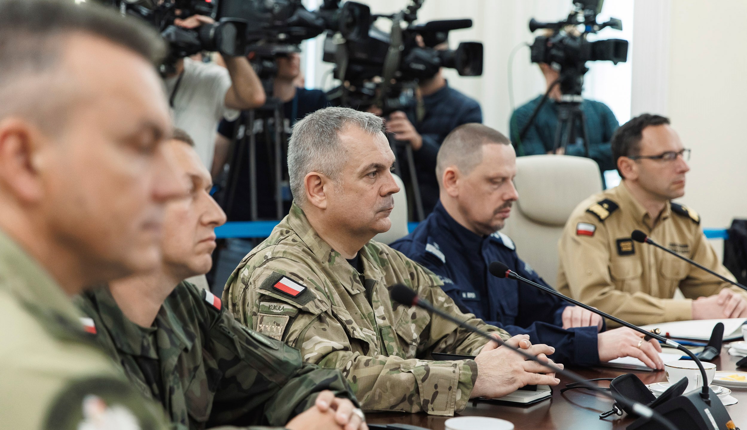Polish officials sitting at a table