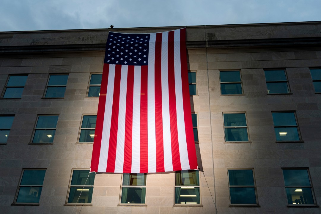 American flag is unfurled from the top of the Pentagon