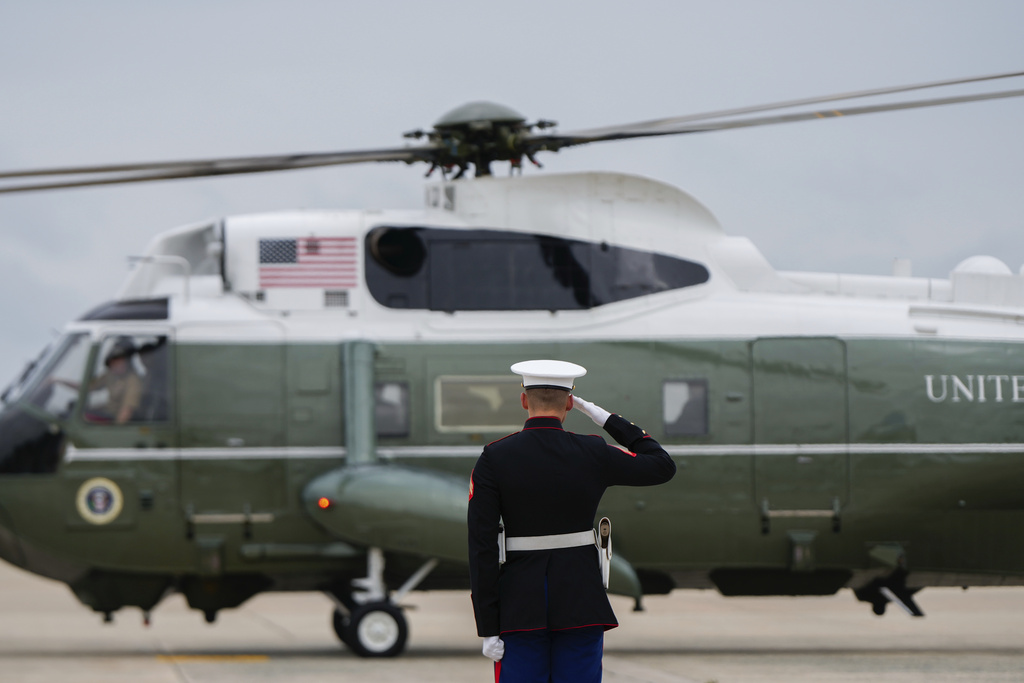 A Marine salutes Marine One