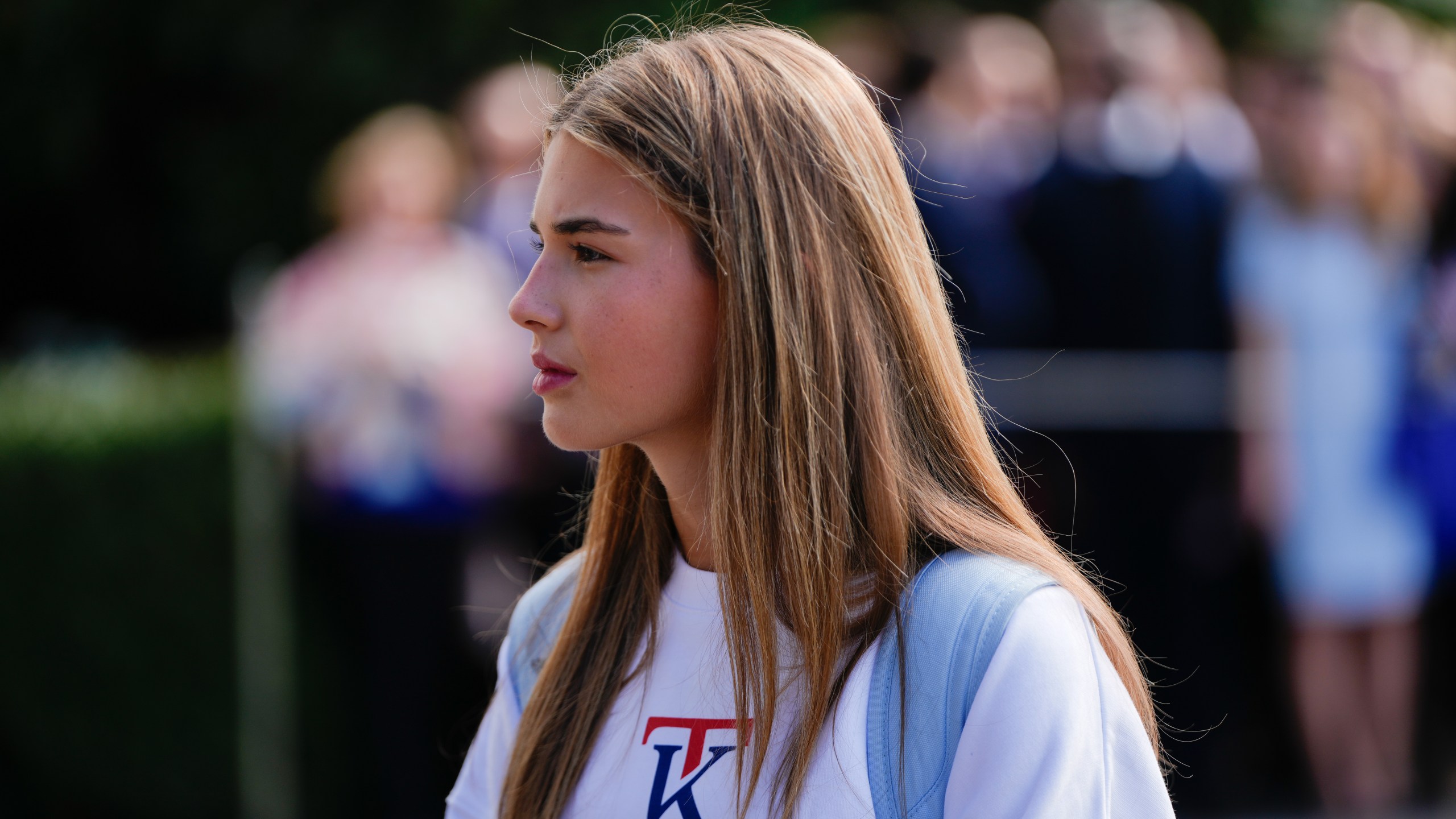 Kai Trump watches as her grandfather President Donald Trump speaks to reporters before departing the White House, Sept. 26, 2025, in Washington. (AP Photo/Julia Demaree Nikhinson)