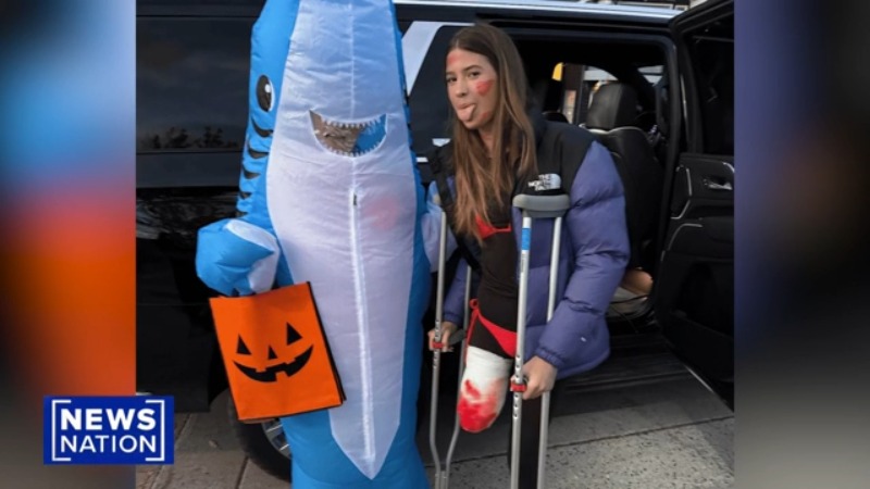 Annabelle Carlson, 16, dressed up as a shark attack survivor next to her friend in a shark costume (image from Annabelle Carlson)