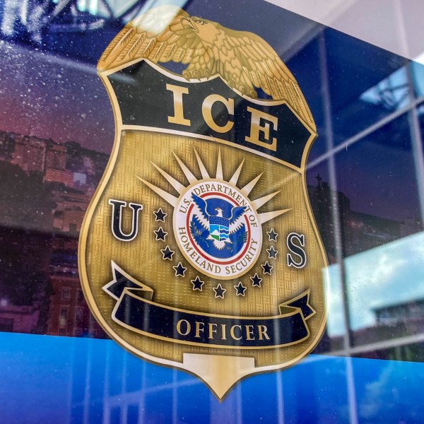 An ICE officer badge logo