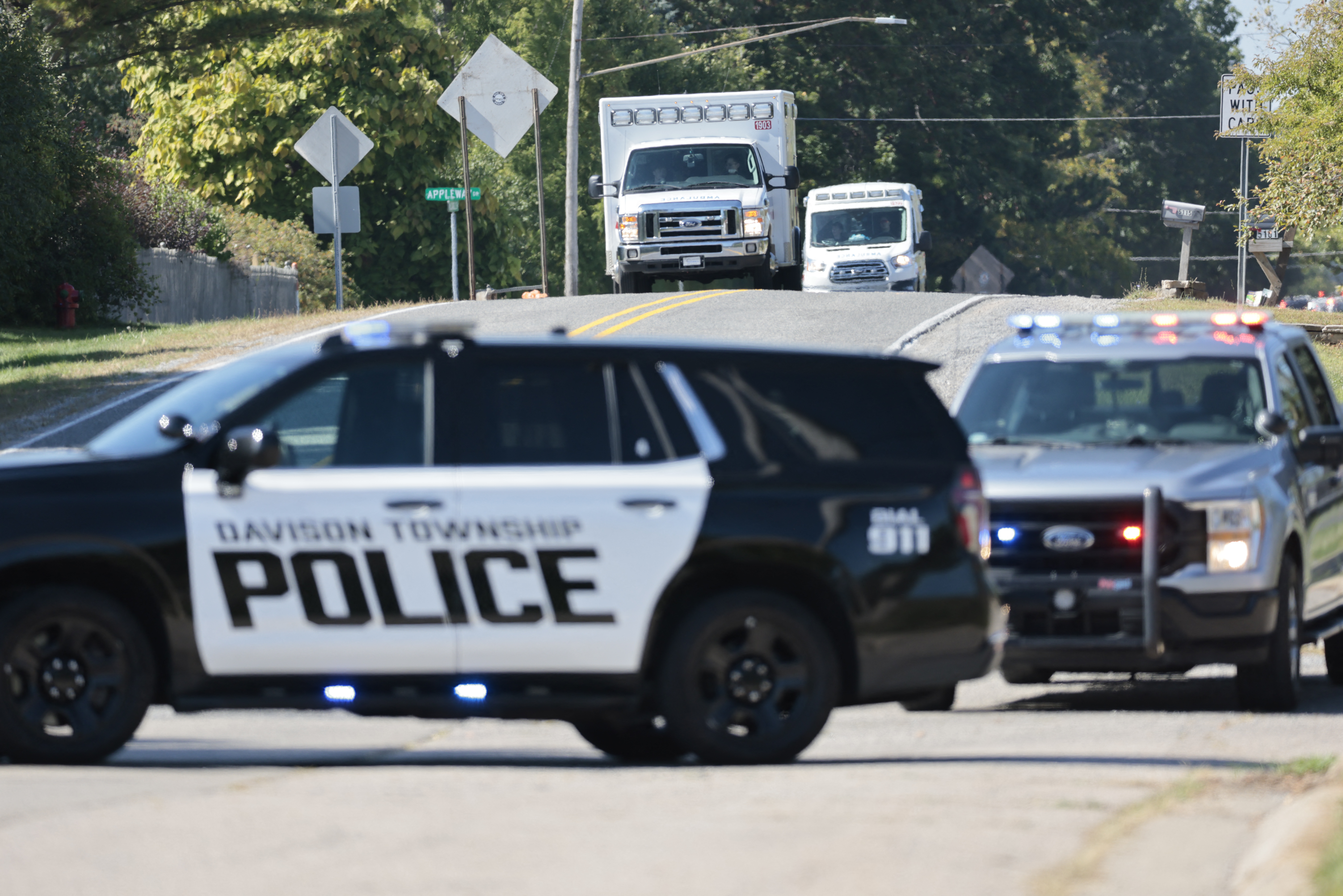 Police and emergency vehicles respond near the scene of a shooting at a church in Grand Blanc, Michigan, on September 28, 2025