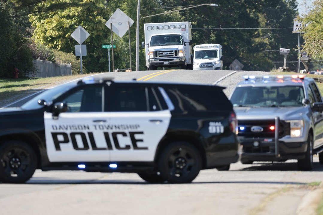 Police and emergency vehicles respond near the scene of a shooting at a church in Grand Blanc, Michigan, on September 28, 2025