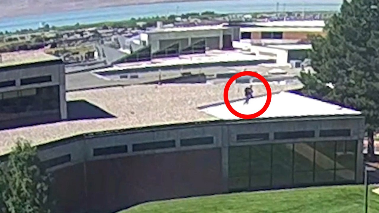 A person of interest in Charlie Kirk's shooting death is seen jumping off the roof of a building