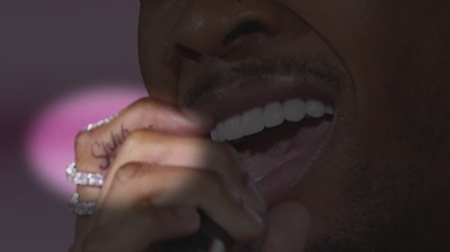 A closeup of D4vd's "Shhh..." tattoo