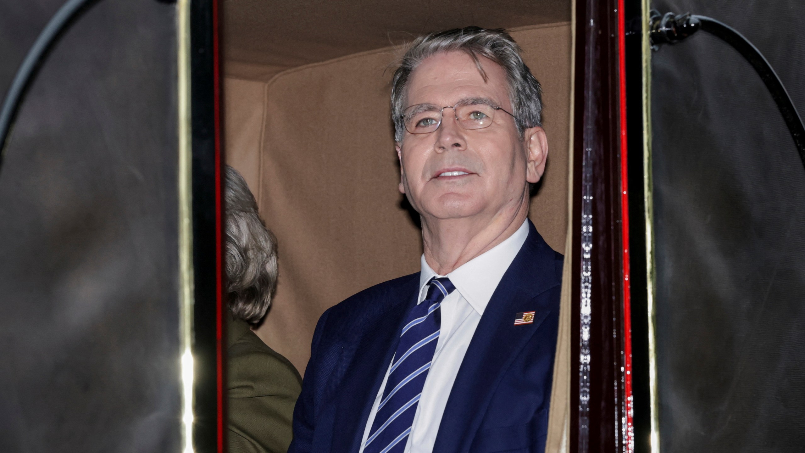 US Treasury Secretary Scott Bessent rides in a carriage during a procession through Windsor Castle on the occasion of President Donald Trump's visit, in Windsor, England, Wednesday, Sept. 17, 2025. (Toby Melville/Pool Photo via AP)