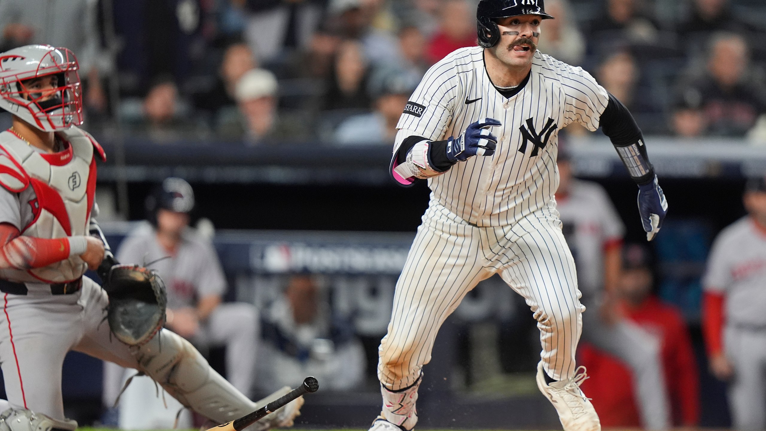 New York Yankees Austin Wells makes his way to first base after connecting for an RBI single to right field that allowed Jazz Chisholm Jr. to score the go-ahead run against the Boston Red Sox during the eighth inning of Game 2 of an American League wild-card baseball playoff series, Wednesday, Oct. 1, 2025, in New York. (AP Photo/Frank Franklin II)