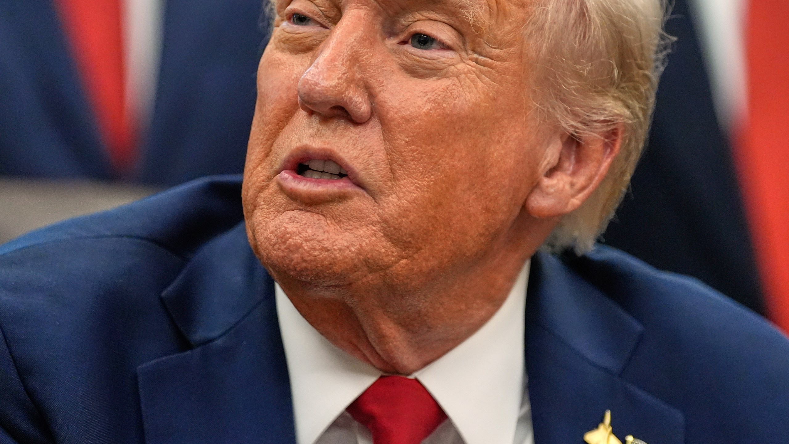 President Donald Trump speaks in the Oval Office of the White House before signing an executive order regarding childhood cancer and the use of AI, Tuesday, Sept. 30, 2025, in Washington. (AP Photo/Alex Brandon)