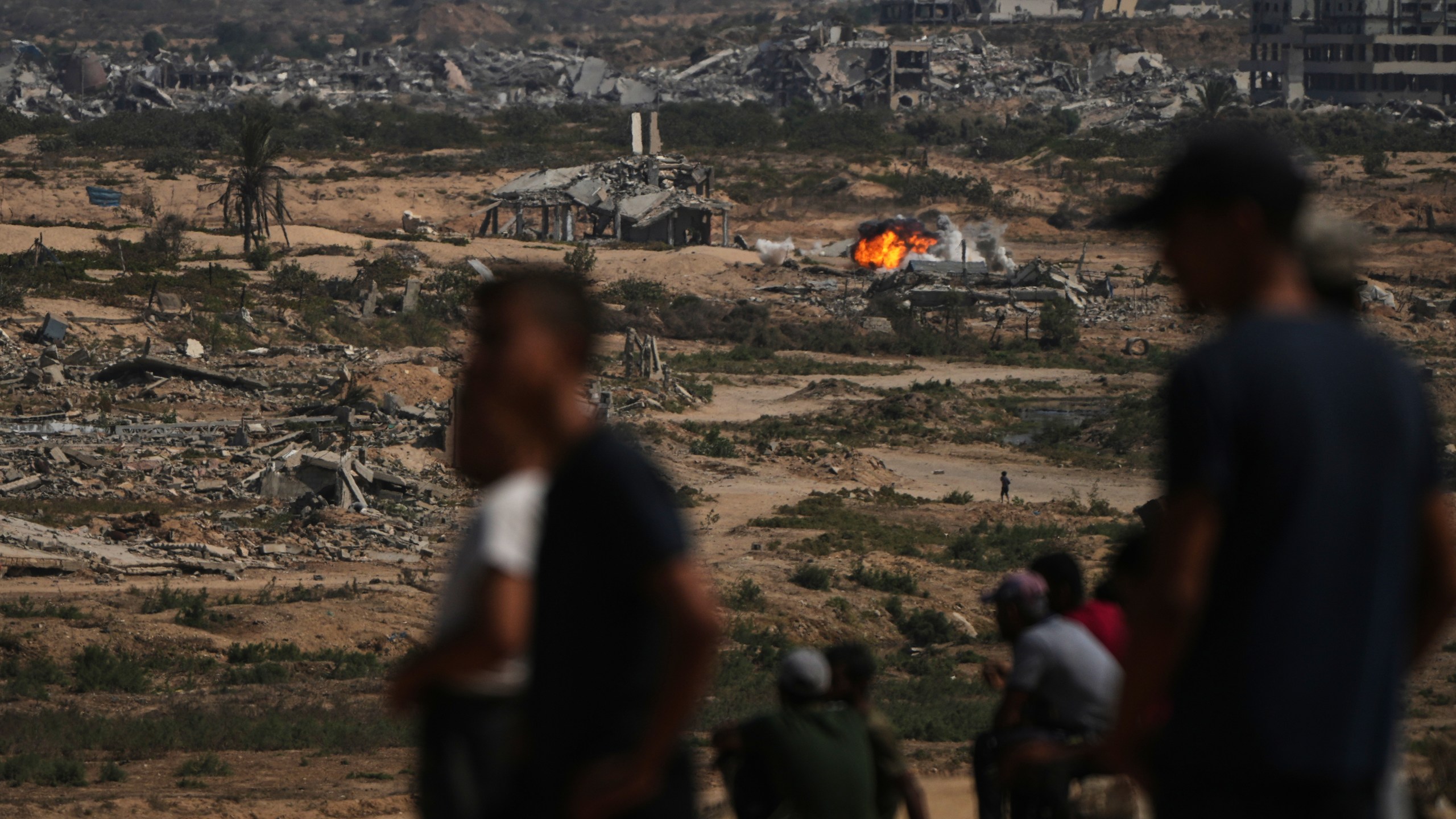 Fire and smoke rises following an Israeli army shelling in Nuseirat, central Gaza Strip, Saturday, Oct. 4, 2025.(AP Photo/Abdel Kareem Hana)