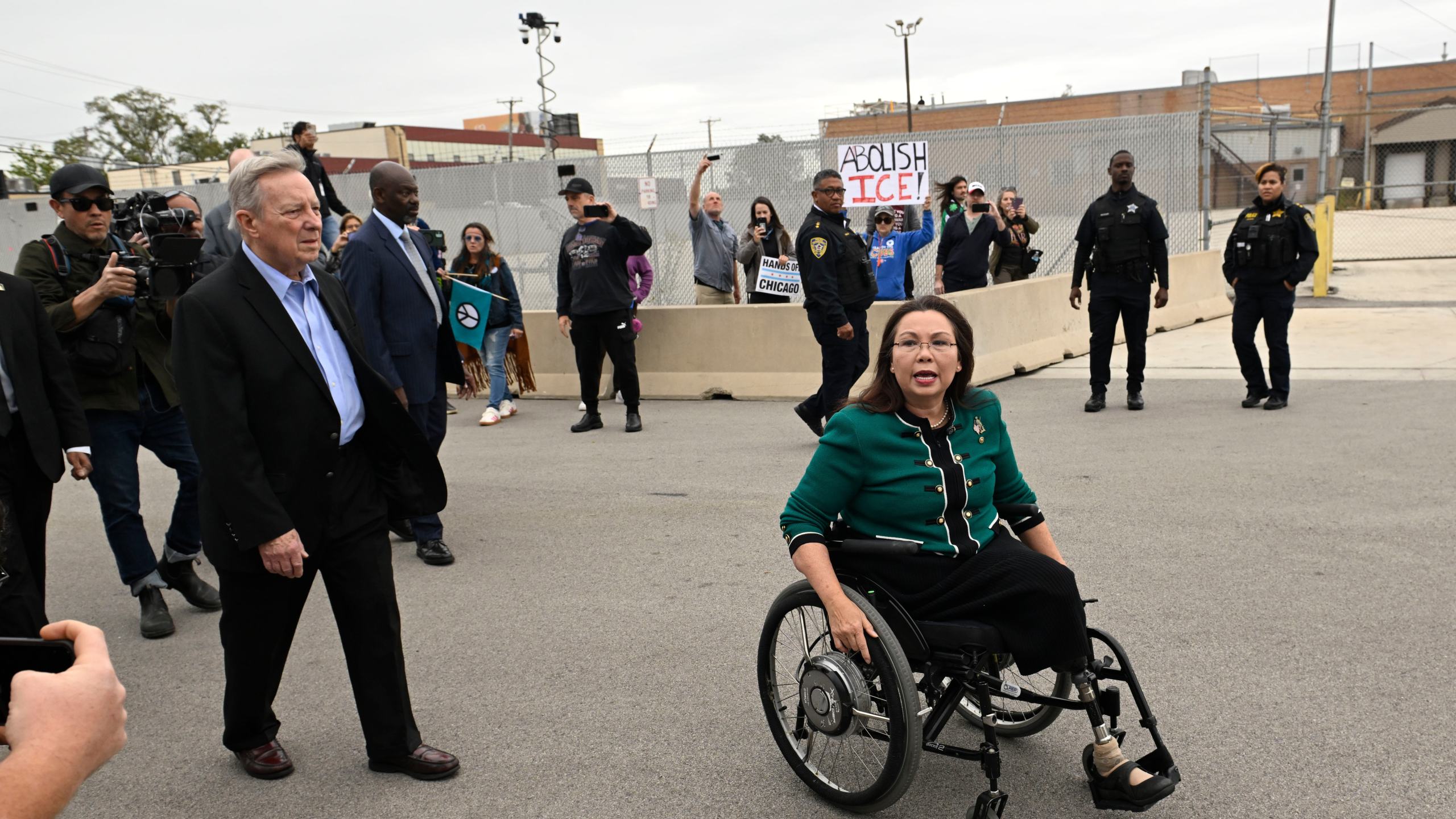 Sen. Tammy Duckworth, D-Ill., and Sen. Dick Durbin, D-Ill., speak to protestors outside the U.S. Immigration and Customs Enforcement facility in Broadview, Ill., Friday, Oct. 10, 2025. (AP Photo/Paul Beaty)