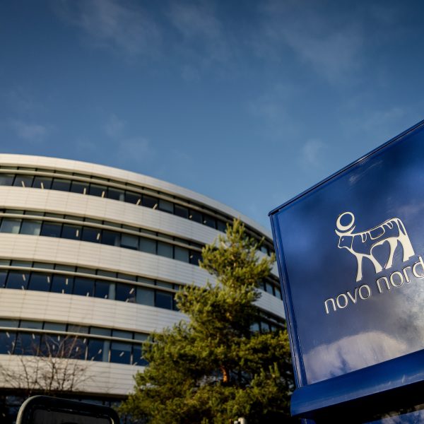Novo Nordisk headquarters building with its blue sign and logo