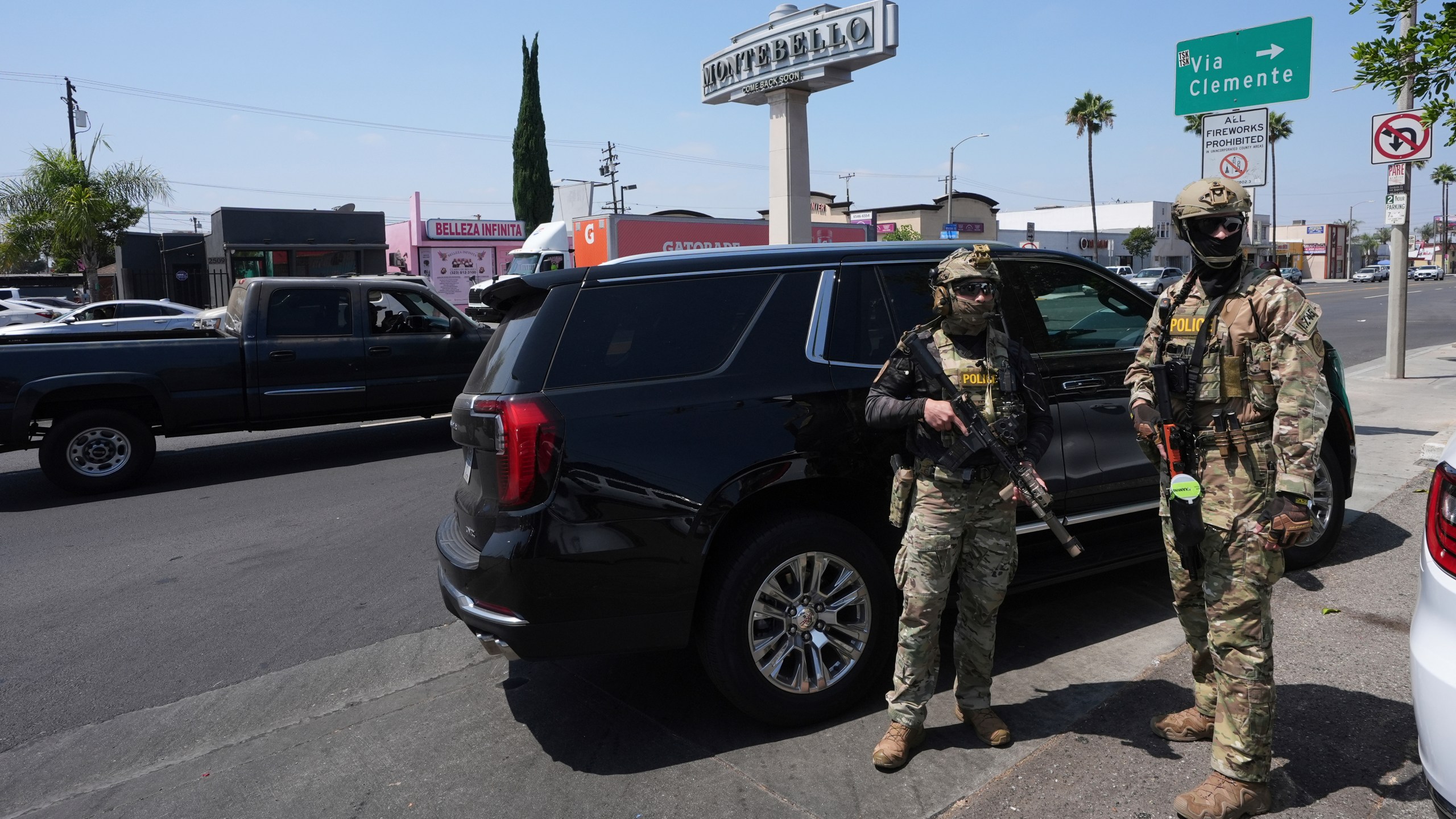 FILE - Immigration agents conduct an operation at a car wash, Aug. 15, 2025, in Montebello, Calif. (AP Photo/Gregory Bull, File)