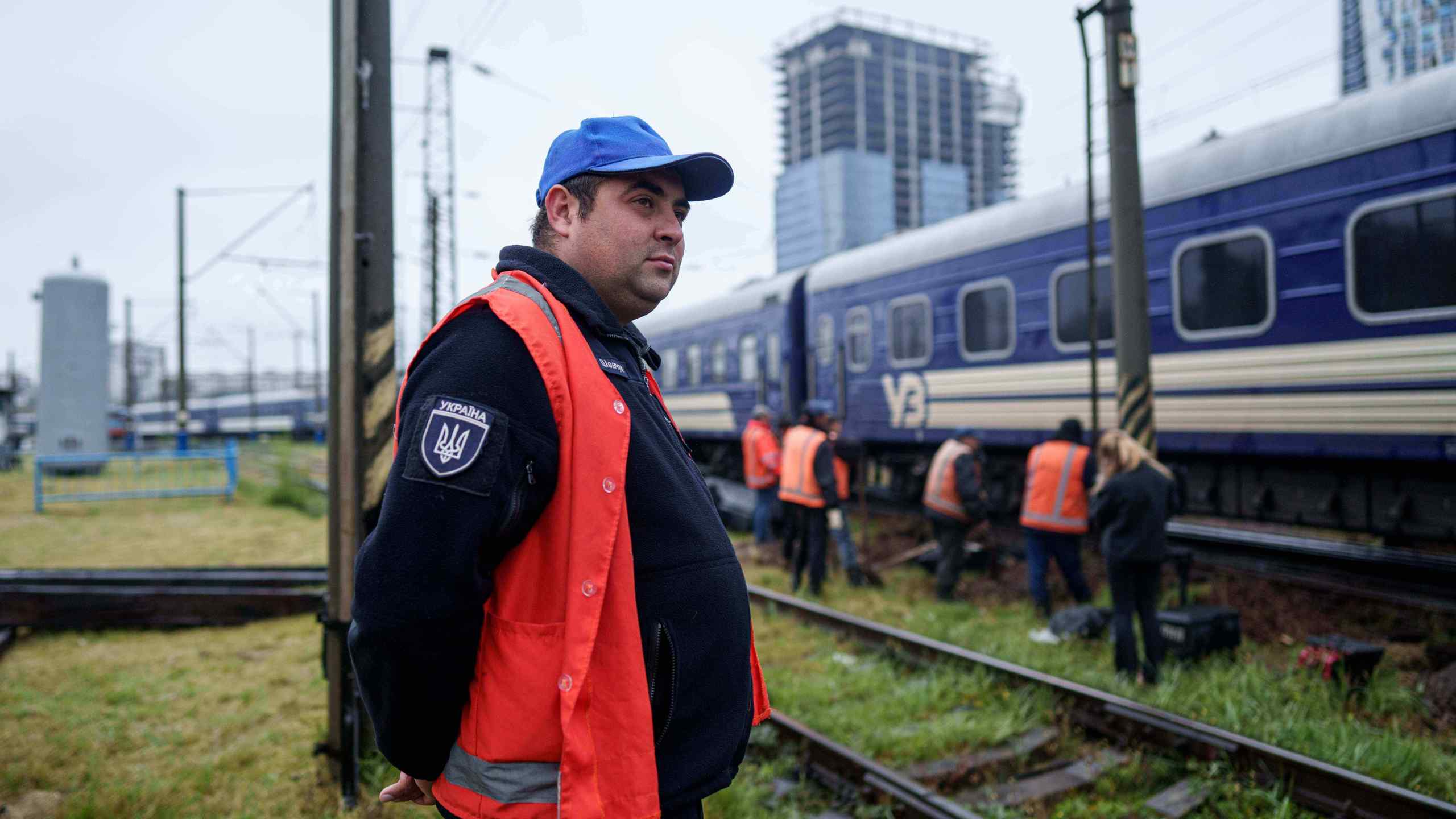 Shevcuk Maksym, 30, a railway repair team leader, looks at railway track repair work in Kyiv, Ukraine, Thursday, Oct. 2, 2025. (AP Photo/Evgeniy Maloletka)