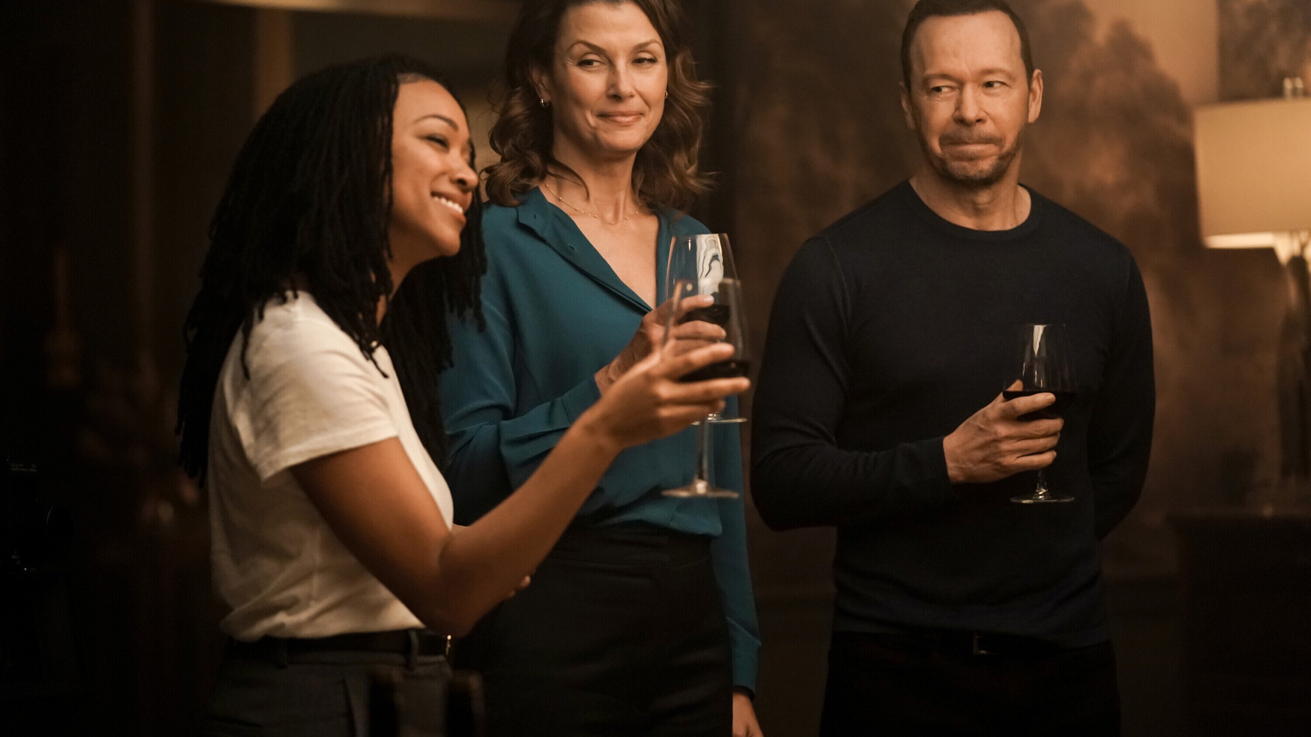 This image released by CBS shows, from left, Sonequa Martin-Green, Bridget Moynahan, and Donnie Wahlberg in a scene from "Boston Blue." (John Medland/CBS via AP)