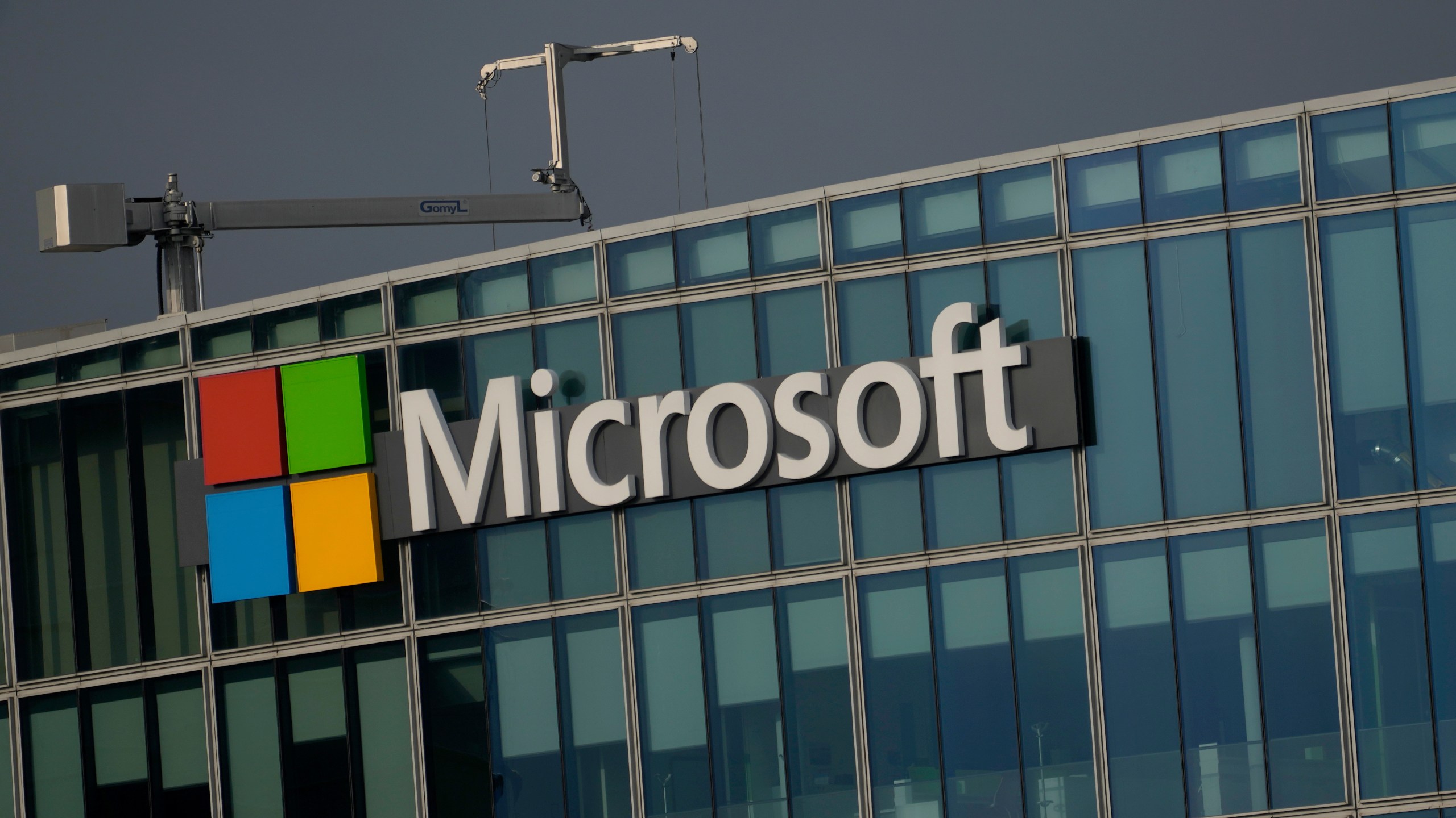 FILE - The logo of Microsoft is seen outside its French headquarters in Issy-les-Moulineaux, outside Paris on May 13, 2024. (AP Photo/Thibault Camus, File)