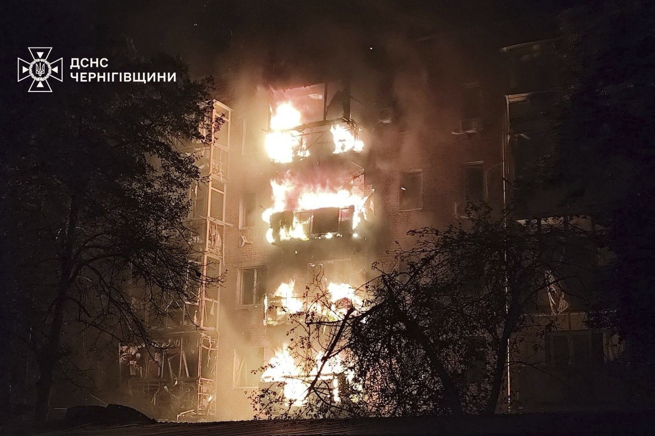 In this photo provided by the Ukrainian Emergency Services on Thursday, Oct. 16, 2025, a residential building is seen on fire after a Russian strike in Nizhyn, Chernihiv region, Ukraine. (Ukrainian Emergency Service via AP)