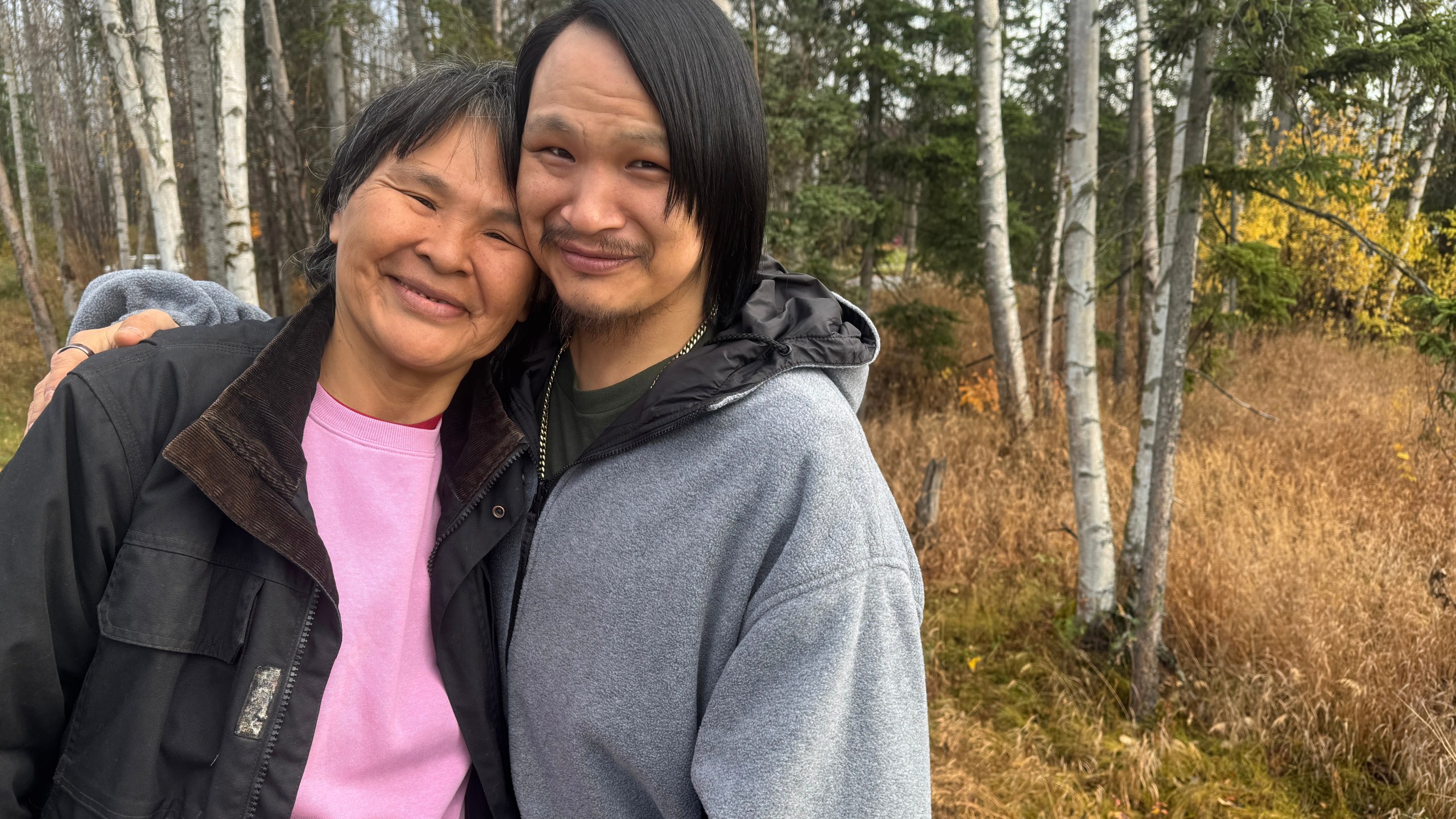 CORRECTS NAME TO ALEXIE, NOT ALEXEI - Julia Stone, left, and her son Alexie pose for a photo Thursday, Oct. 16, 2025, in Anchorage, Alaska, after evacuating the storm-ravaged village of Kipnuk, Alaska. (AP Photo/Mark Thiessen)