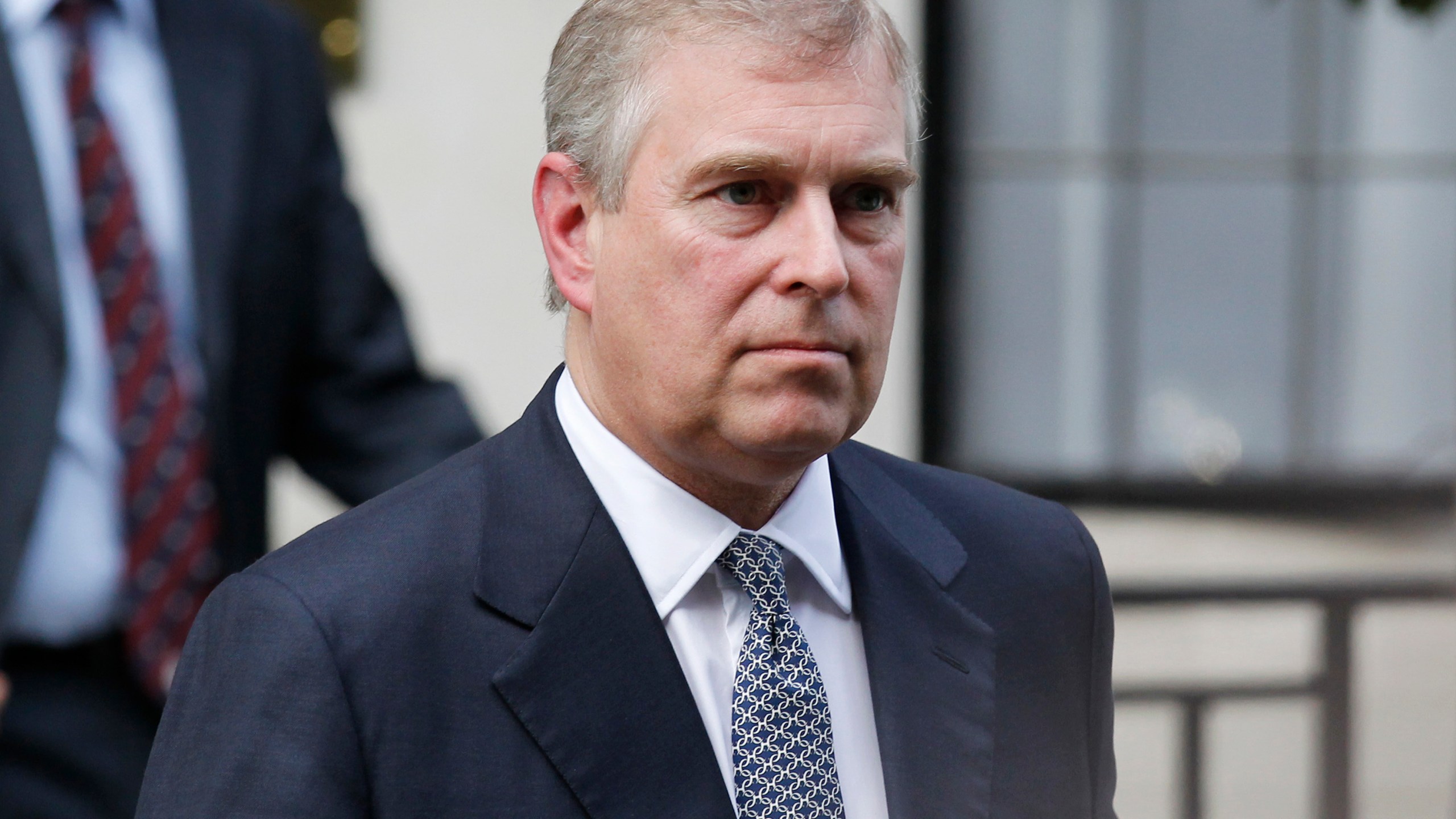 FILE- Britain's Prince Andrew leaves King Edward VII hospital in London after visiting his father Prince Philip, June 6, 2012. (AP Photo/Sang Tan, File)