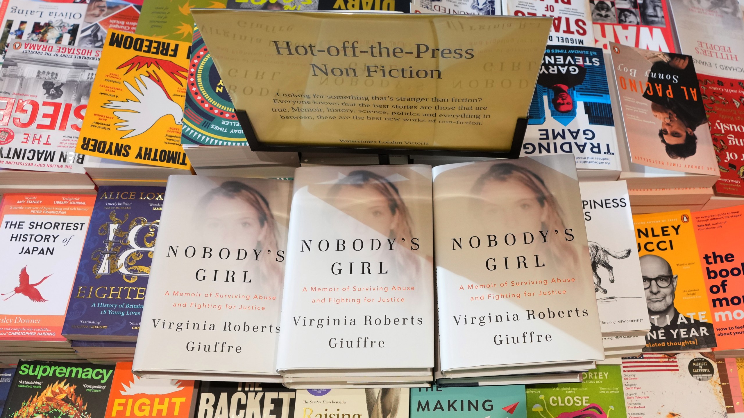 The memoir book of Virginia Giuffre, "Nobody's Girl" is seen amongst other books in a store and is up for sale in London, Tuesday, Oct. 21, 2025 six months after Giuffre died by suicide in April.(AP Photo/Kirsty Wigglesworth)