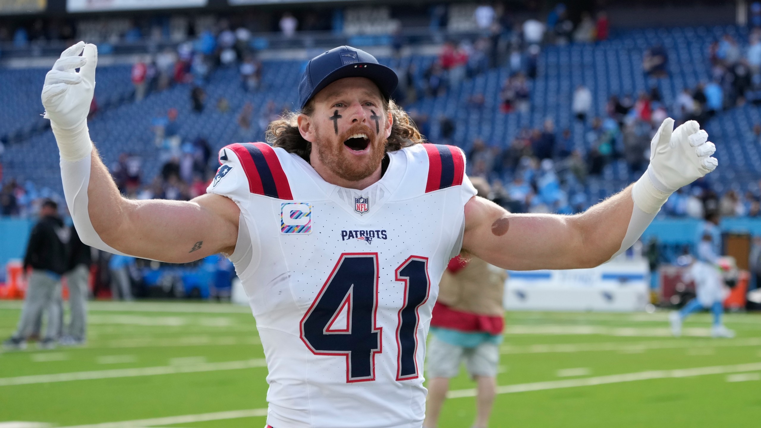 New England Patriots safety Brenden Schooler (41) celebrates following an NFL football game against the Tennessee Titans, Sunday, Oct. 19, 2025, in Nashville, Tenn. (AP Photo/George Walker IV)
