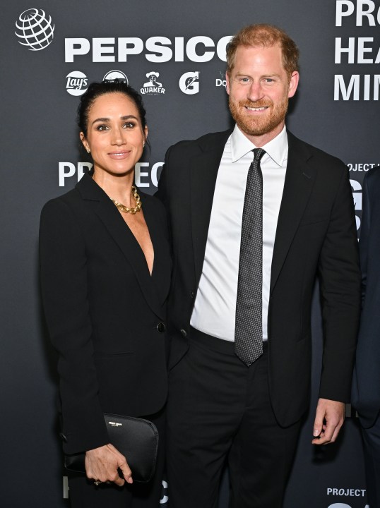 Meghan Markle, left, and Prince Harry, The Duke and Duchess of Sussex, attend the third annual World Mental Health Day Gala, hosted by Project Healthy Minds, at Spring Studios on Thursday, Oct. 9, 2025, in New York. (Photo by Evan Agostini/Invision/AP)