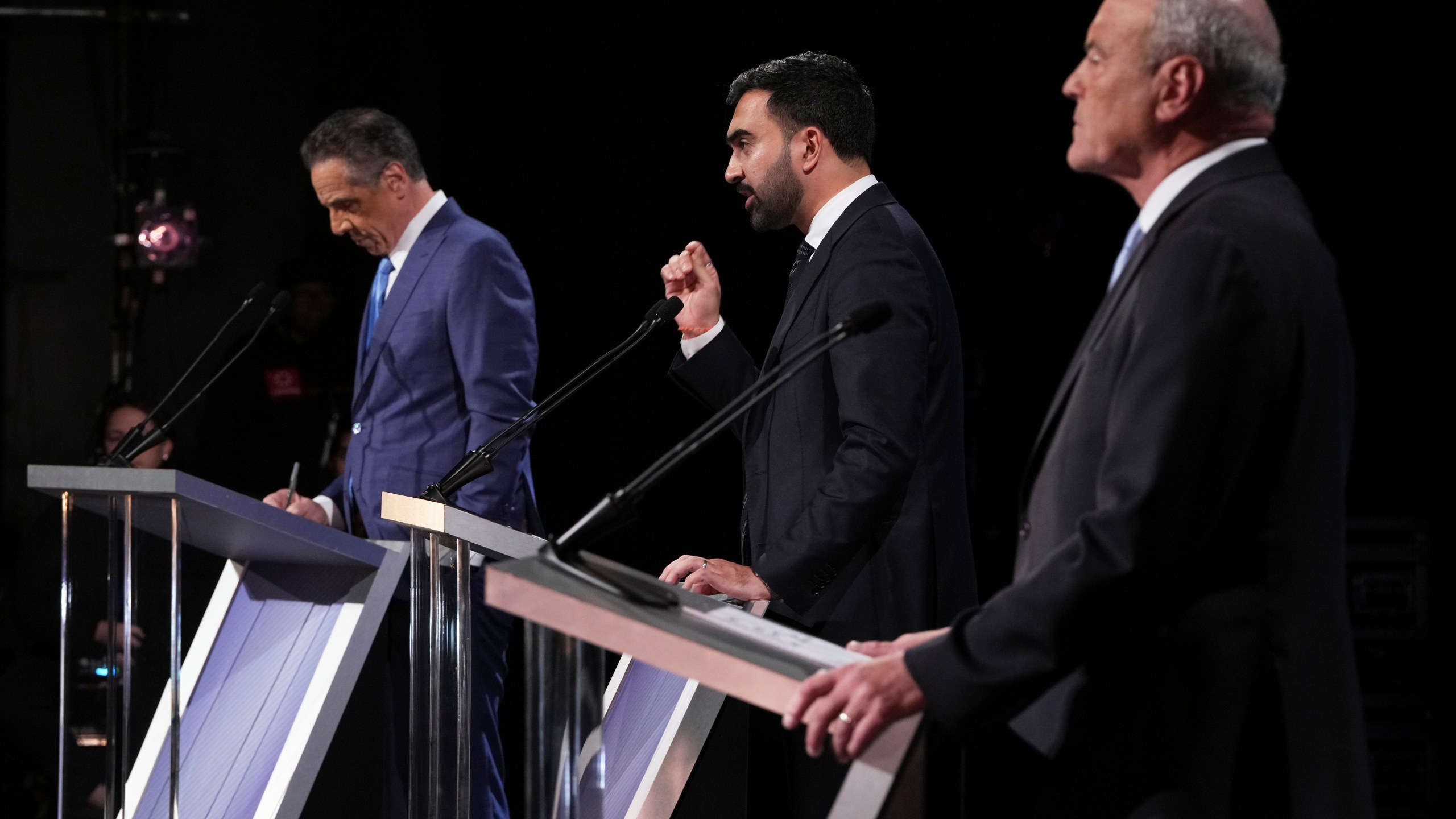 Independent candidate former New York Gov. Andrew Cuomo, Republican candidate Curtis Sliwa and Democratic candidate Assemblyman Zohran Mamdani participate in a second New York City mayoral debate at LaGuardia Performing Arts Center at LaGuardia Community College in the Queens borough of New York, Wednesday, Oct. 22, 2025. (Hiroko Masuike/The New York Times via AP, Pool)