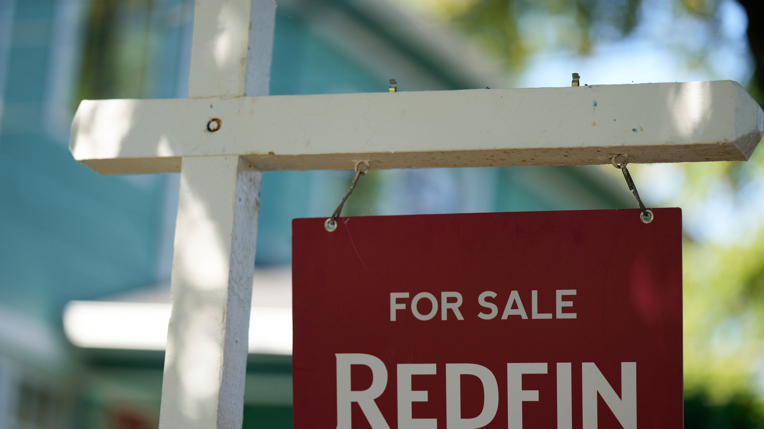FILE - A "For Sale" sign is displayed outside a home on Friday, July 11, 2025, in Portland, Ore. (AP Photo/Jenny Kane, File)