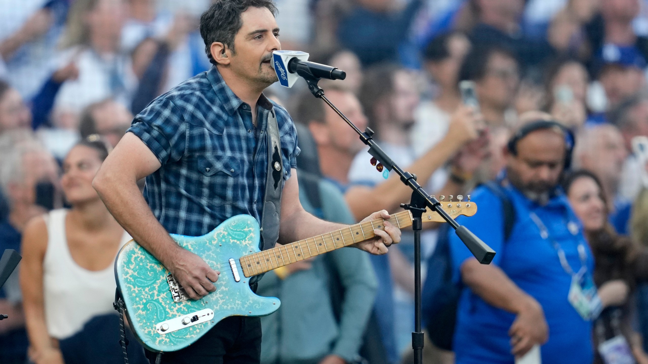 Recording artist Brad Paisley perform the national anthem prior to Game 3 of baseball's World Series between the Toronto Blue Jays and the Los Angeles Dodgers, Monday, Oct. 27, 2025, in Los Angeles. (AP Photo/Ashley Landis)
