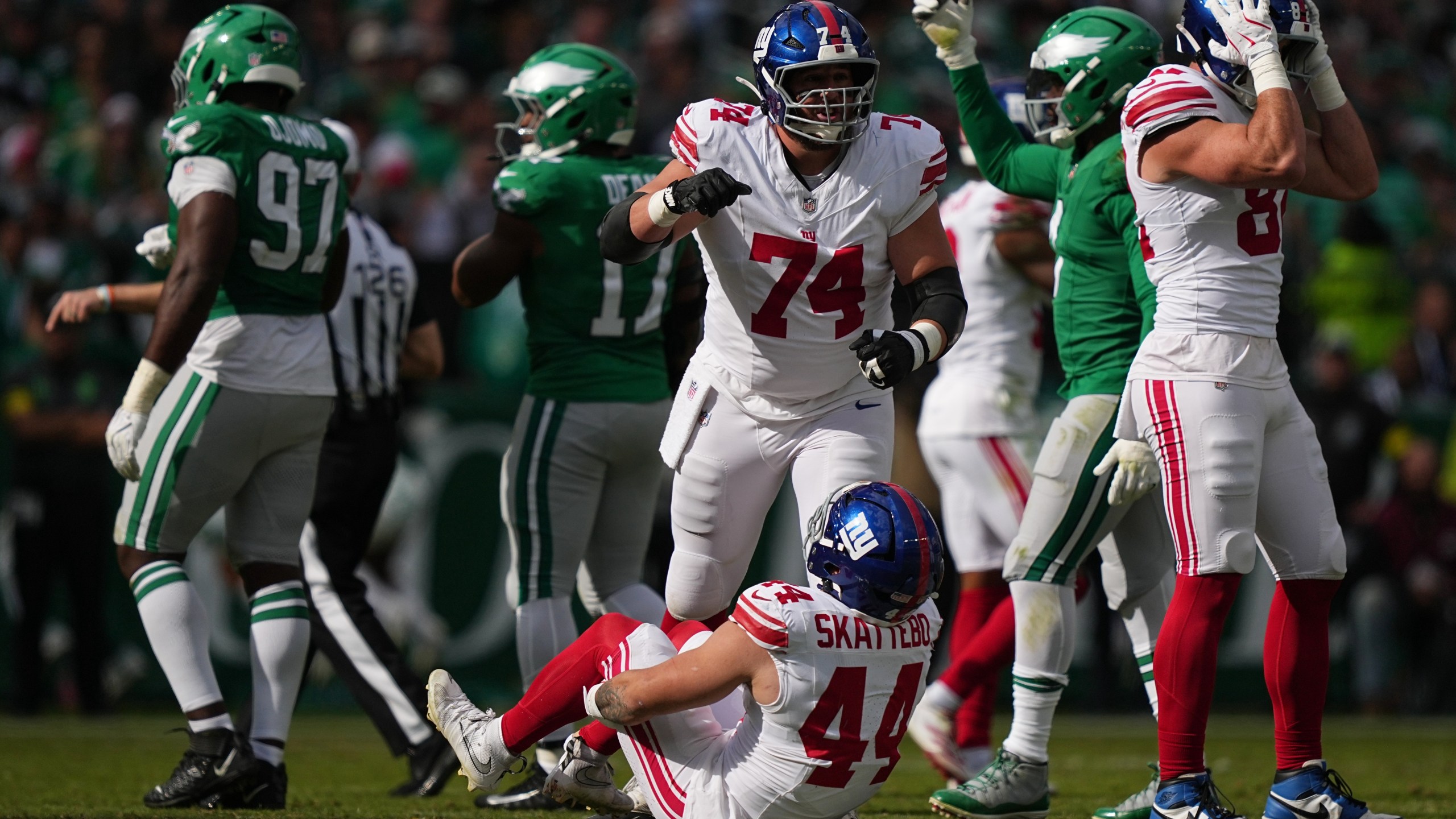New York Giants running back Cam Skattebo (44) reacts after an injury during the first half of an NFL football game against the Philadelphia Eagles on Sunday, Oct. 26, 2025, in Philadelphia. (AP Photo/Matt Rourke)