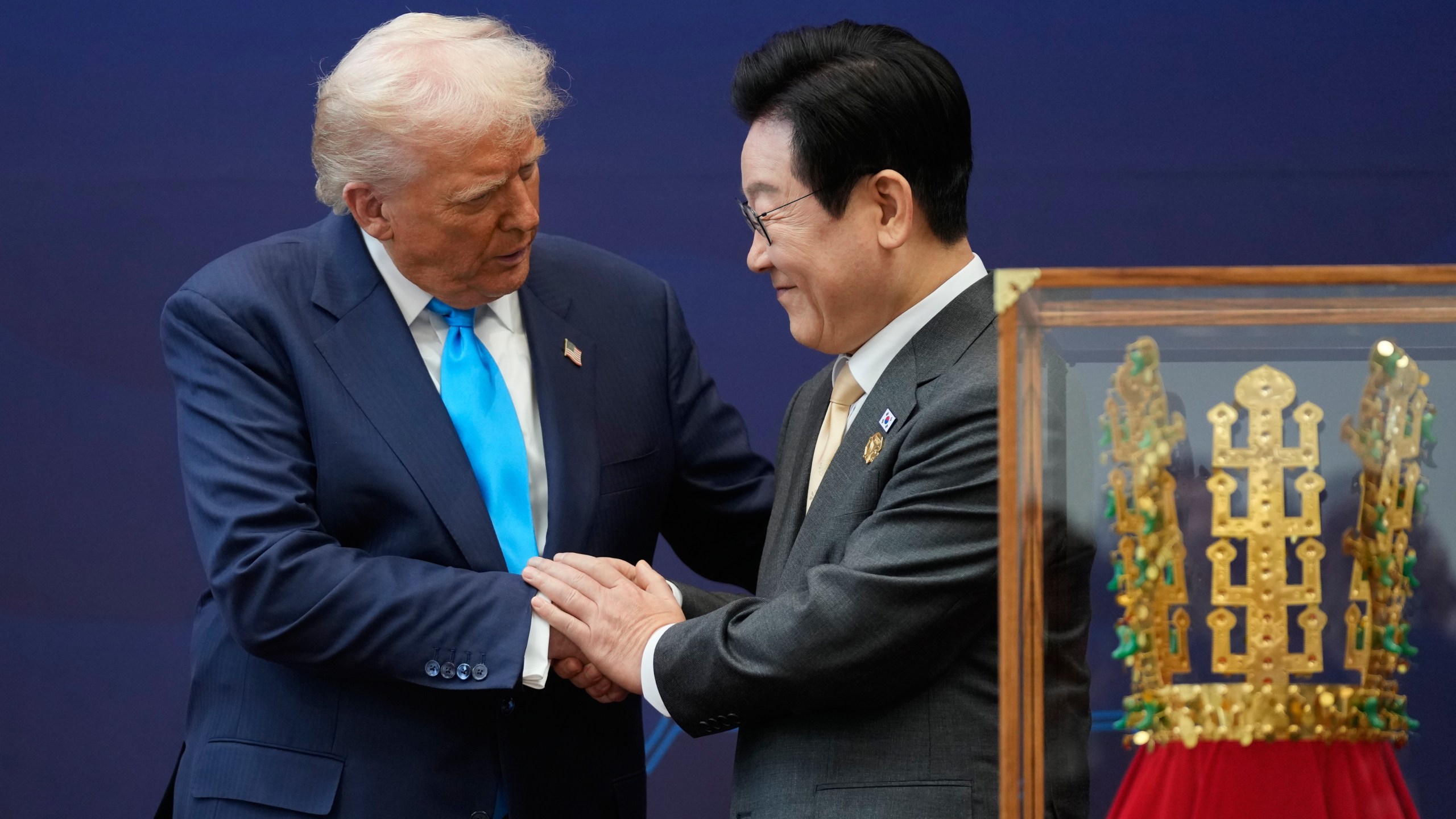 President Donald Trump shakes hands with South Korean President Lee Jae Myung as they attend a high honor ceremony at the Gyeongju National Museum in Gyoeongju, South Korea, Wednesday, Oct. 29, 2025. (AP Photo/Mark Schiefelbein)