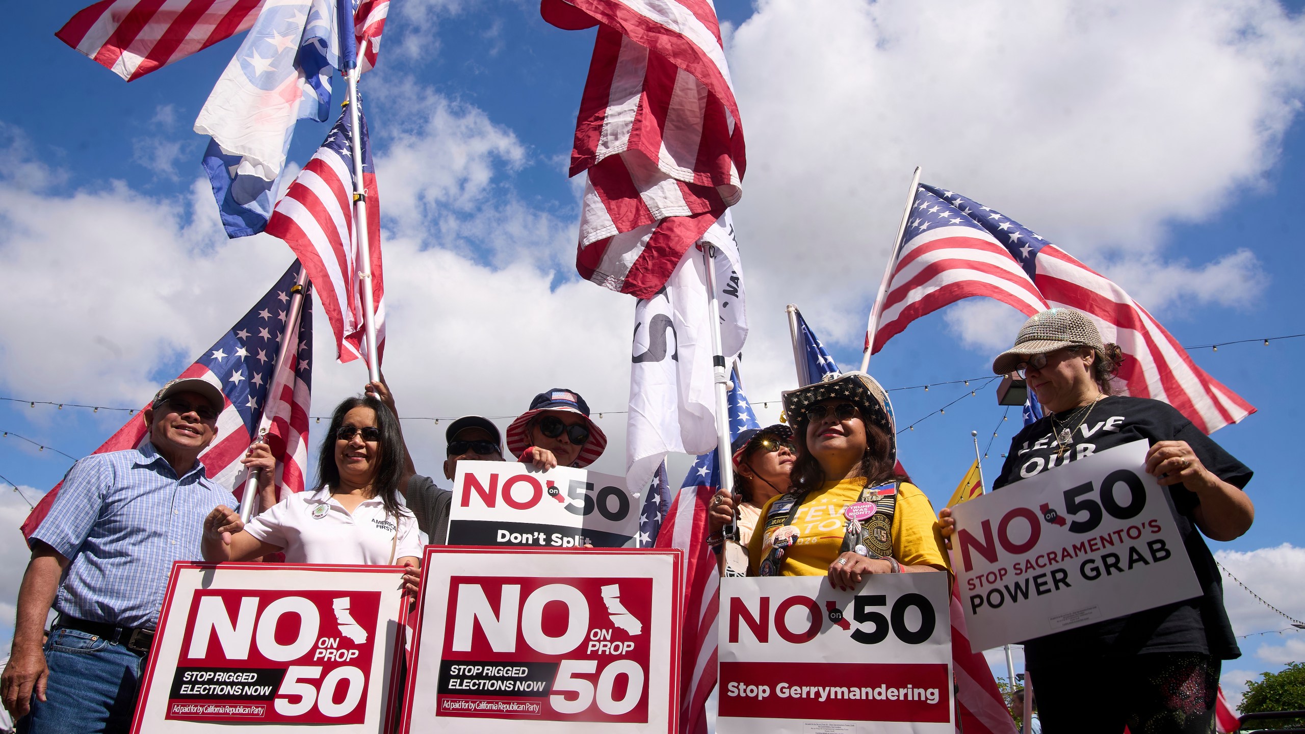 FILE - Opponents of California Proposition 50, also known as the Election Rigging Response Act, a California ballot measure that would redraw congressional maps to benefit Democrats, rally in Westminster, Calif., Sept. 10, 2025. (AP Photo/Damian Dovarganes, File)