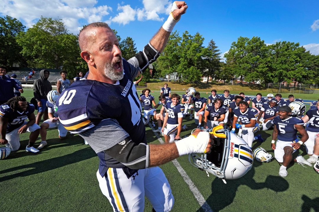 After seeing his first college football game action, Lycoming College nose tackle Tom Cillo (40) and teammates celebrate a 23-16 win over King's College in an NCAA Division III junior varsity college football game in Williamsport, Pa., Sunday, Sept. 28, 2025