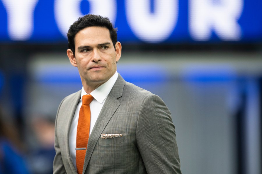 Mark Sanchez walks on the field before an NFL football game