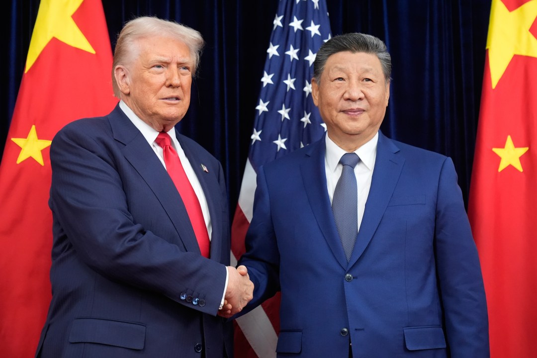 Trump and Chinese President Xi Jinping shake hands