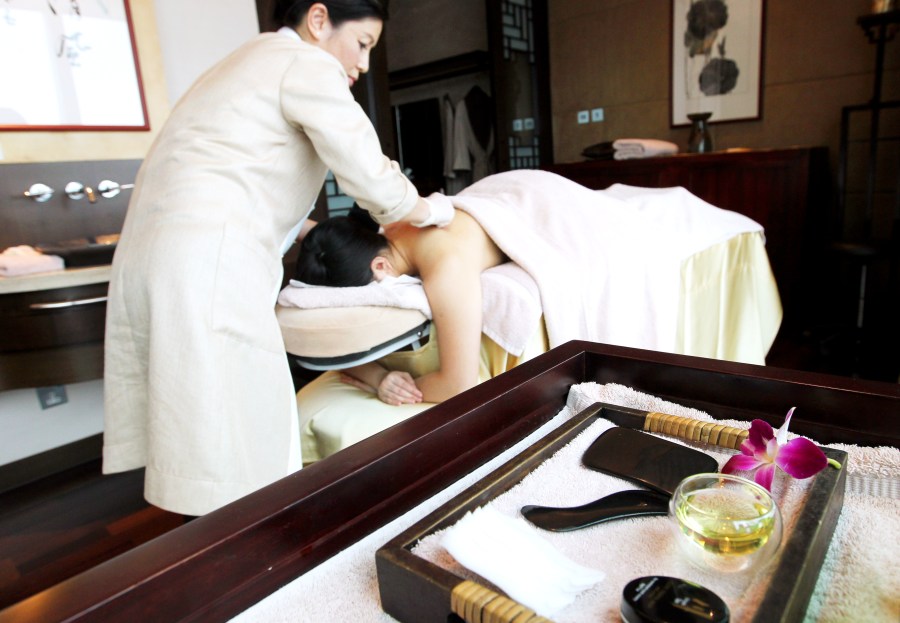 Dr Gladys Leung, Traditional Chinese Medicine Consultant of Chuan Spa administering the "Gua sha" at Chuan Spa, Langham Place in Mong Kok