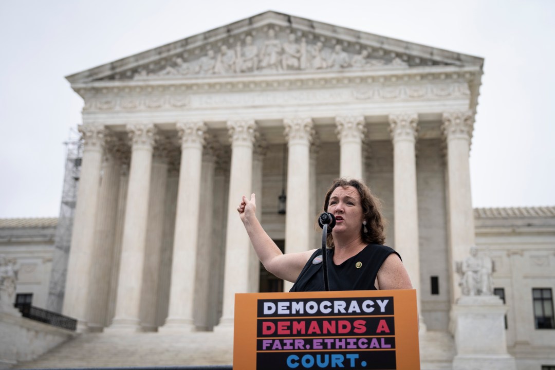 Rep. Katie Porter speaks during a small rally in front of the Supreme Court building