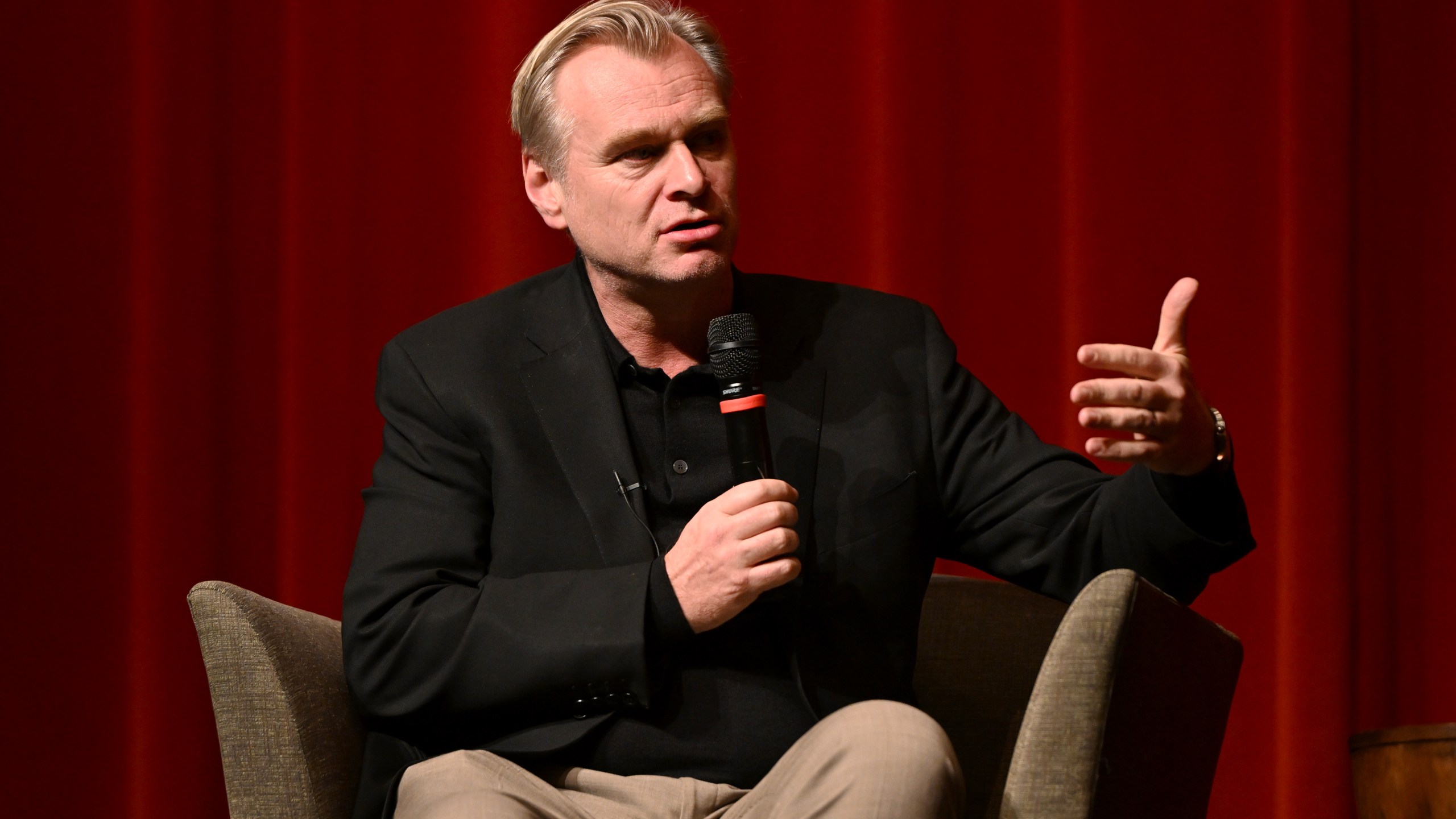 Christopher Nolan speaks onstage during a "Gladiator II" conversation with Director Ridley Scott and Director Christopher Nolan in Los Angeles at the DGA Theater Complex on December 10, 2024, in Los Angeles, California.