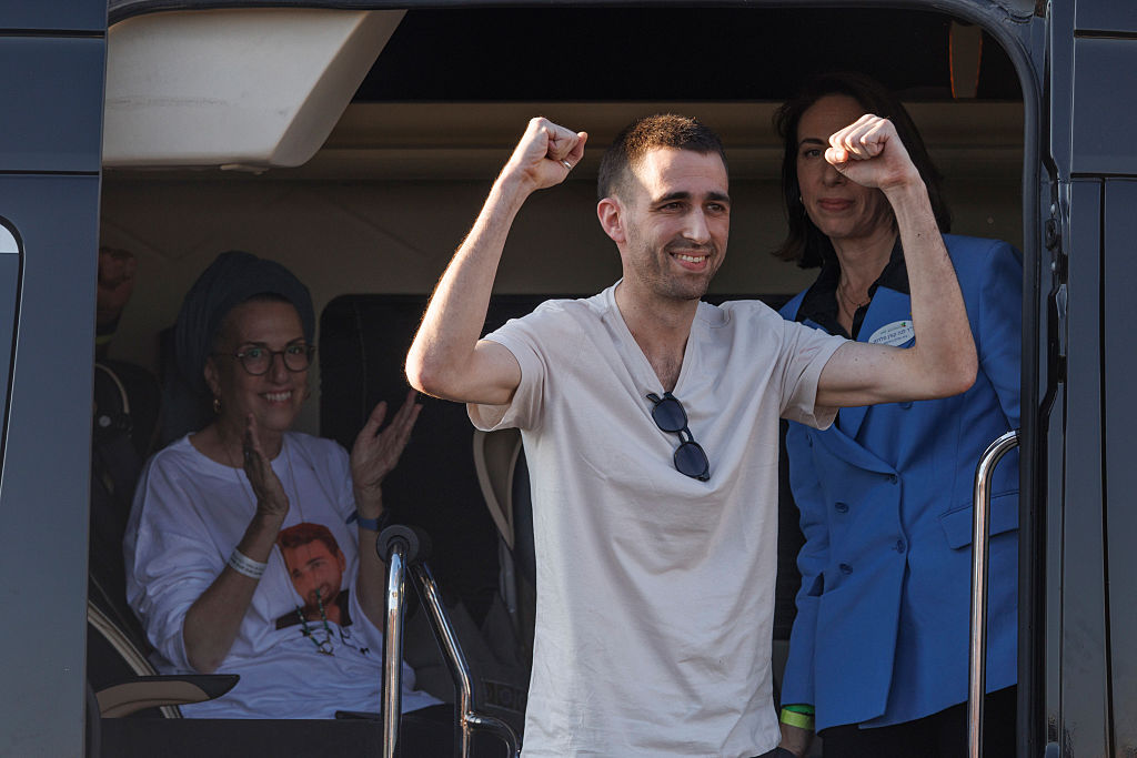 Avinatan Or lifts his arms in celebration