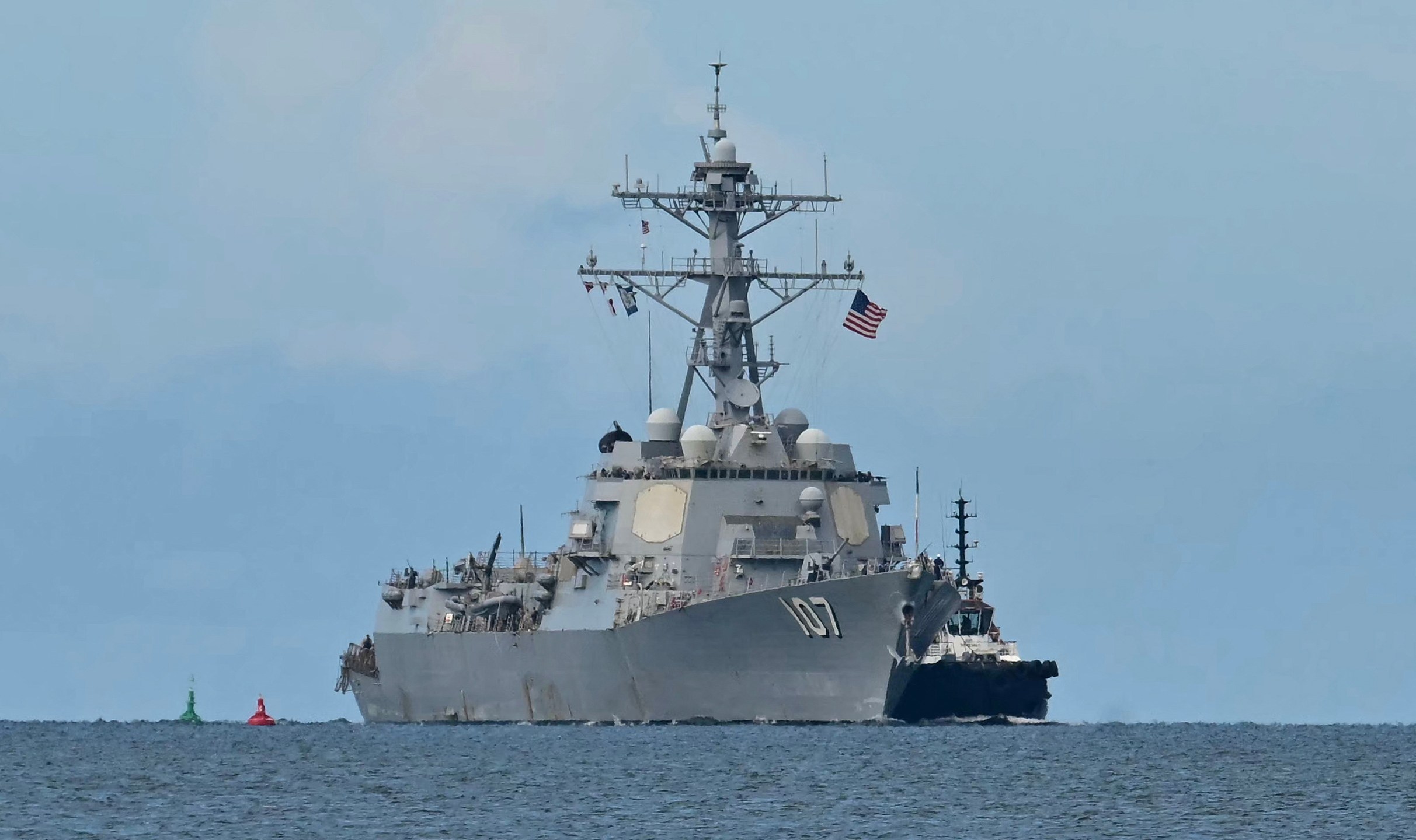 The USS Gravely warship is seen at a distance off the coast of Port of Spain