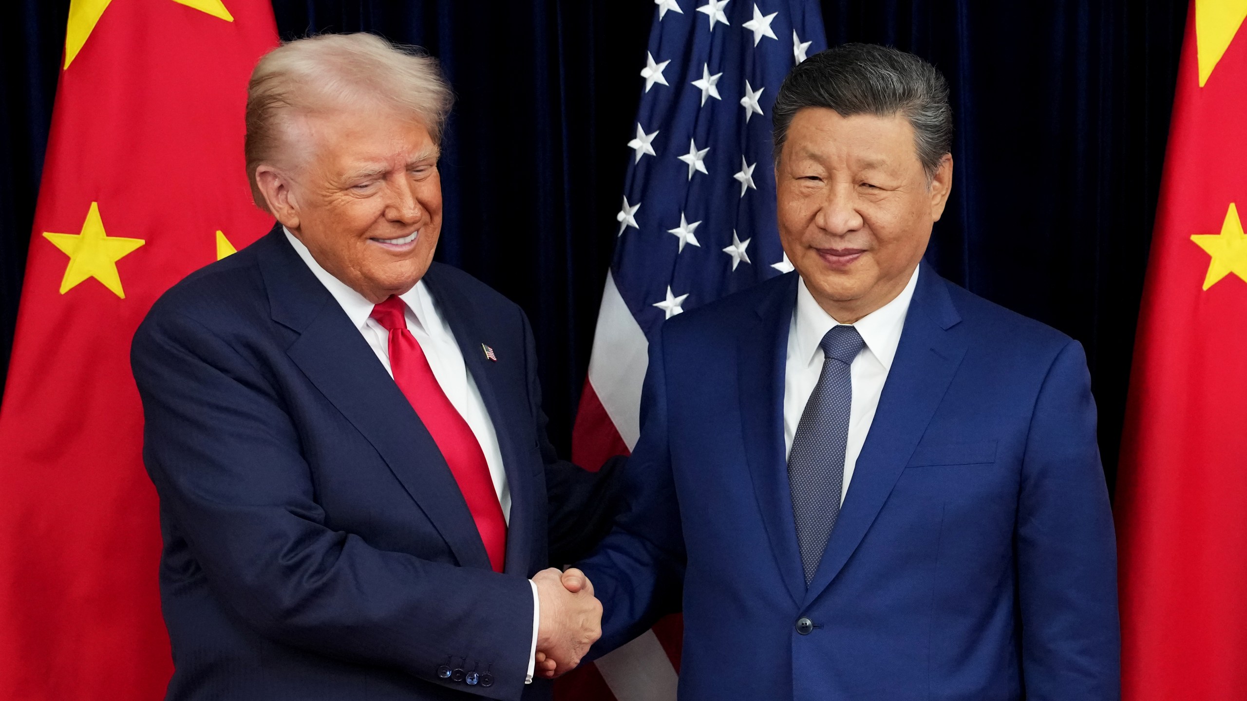 Trump Meets shakes hands with President Xi