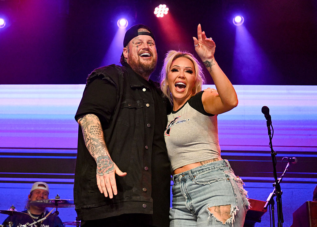 Jelly Roll and Bunnie Xo embrace onstage