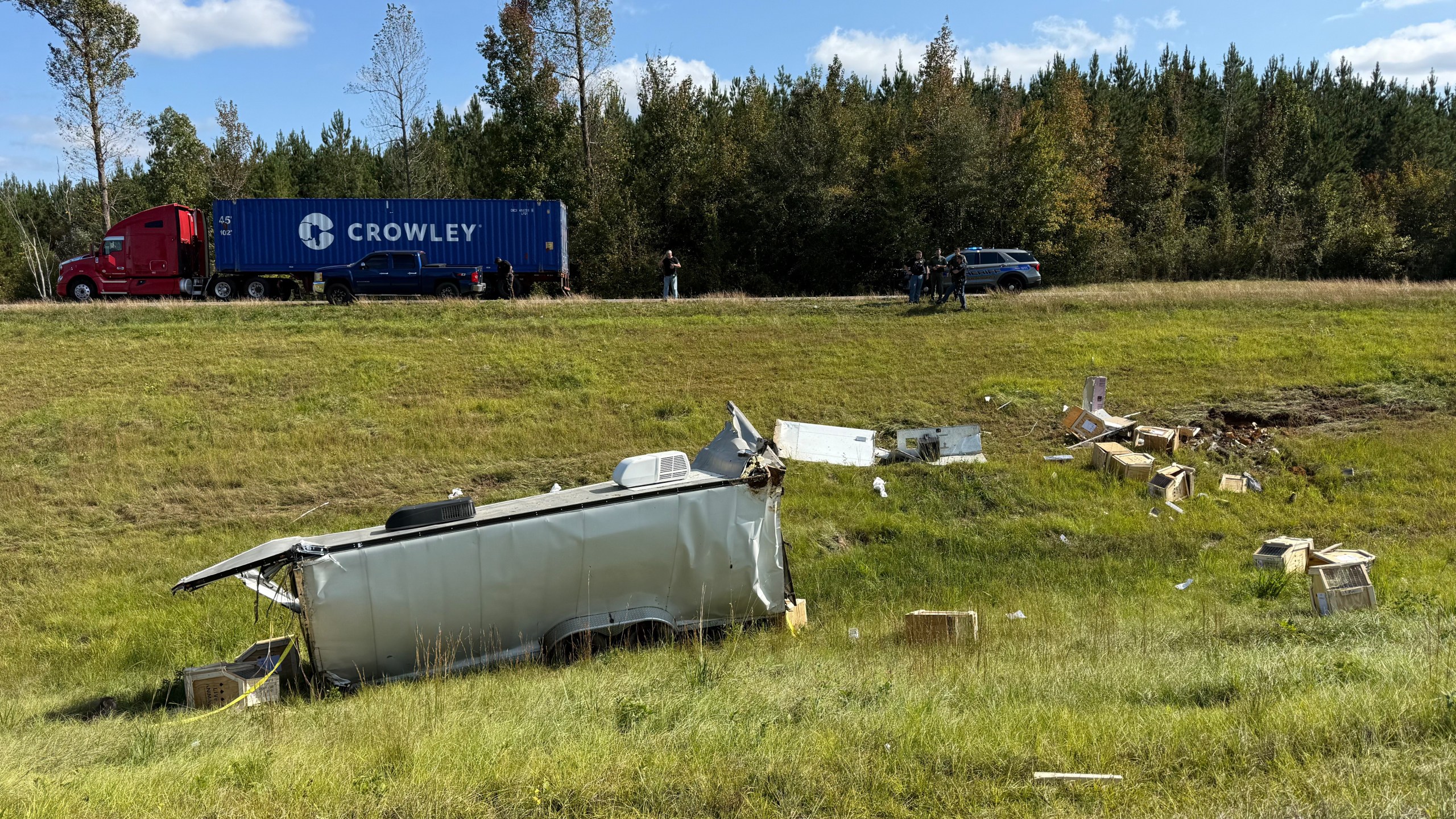 This photo provided by Scotty Ray Boyd shows an overturned truck which had been transporting several monkeys, Tuesday, Oct. 28, 2025, in Heidelberg, Miss. (Scotty Ray Boyd via AP)
