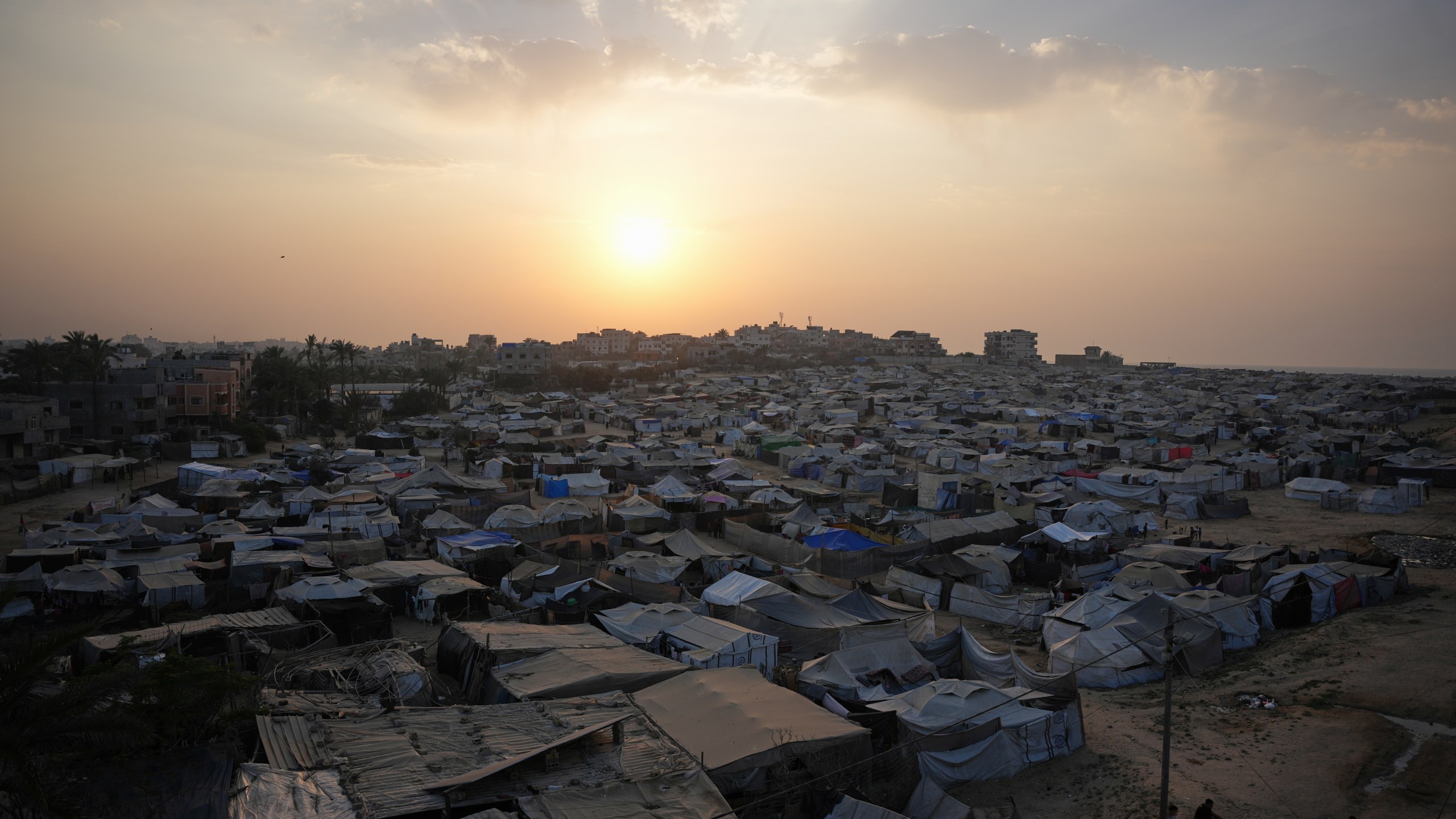 A tent camp for displaced Palestinians stretches along Zawaida in the central Gaza Strip on Tuesday, Nov. 4, 2025. (AP Photo/Abdel Kareem Hana)